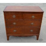 Early C19th mahogany chest of two short above two long graduated cock beaded drawers with oval brass