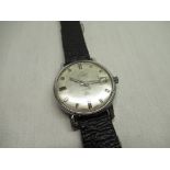 Transglobe automatic wristwatch with date indicator, chrome plated case on black leather strap screw