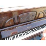 Walnut cased upright piano marked the Carlton model