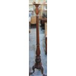 Mahogany column standard lamp on three ornately carved outsplayed supports and carved paw feet and