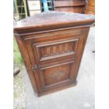 Small C18th style oak corner cupboard with lozenge and arcade carved door, W59 D33 H80cm