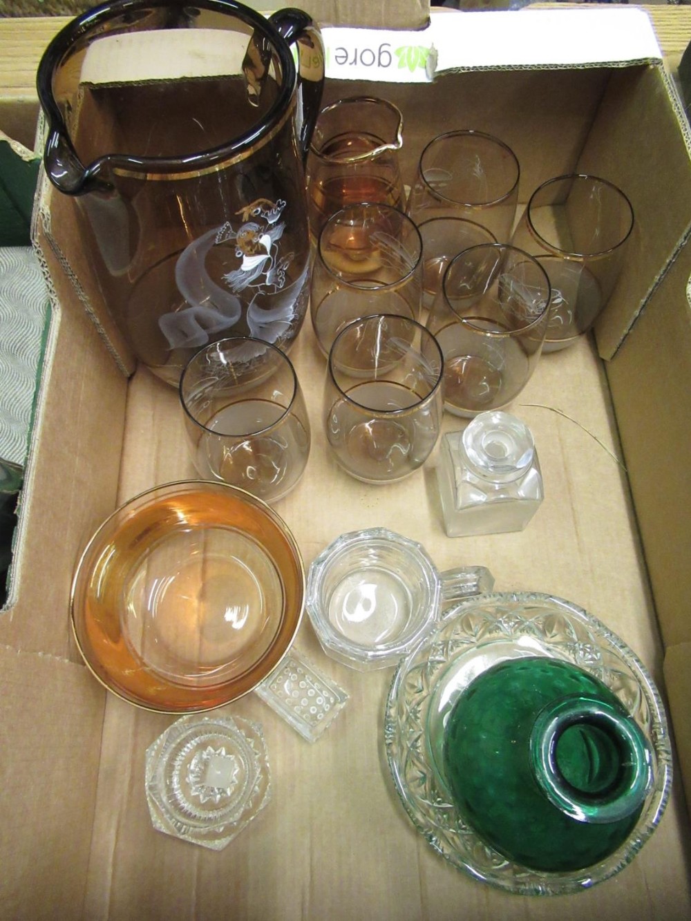 Box of various glassware including water jug with painted flamenco design and a set of six