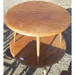 Ercol light elm coffee table, circular top on three turned outsplayed supports D75cm H43cm, and