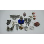 Collection of costume brooches including one abalone circular brooch with foreign stamp to back, a