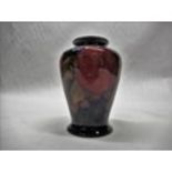 Moorcroft tapering vase decorated in Pomegranate pattern on a blue ground, impressed marks to