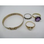 Child's 9ct gold bangle, a 9ct gold solitaire ring with claw set purple stone and two other unmarked