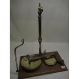Early C20th patented brass apothecary scale on molded mahogany base patent no. 33133 H57 1/2cm