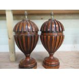 Pair of Regency style urn shaped vases and covers, of lobed form with pineapple finials on stepped