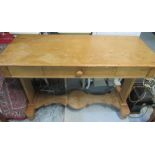 C20th pine side table, rectangular top with single drawer, solid end supports joined by a