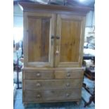 Victorian pine cupboard on chest with moulded cornice, two panelled doors above two short and two