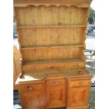 Victorian pine dresser, three tier back with three spice drawers, the inverted break front base with