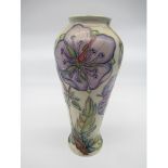 Moorcroft pottery vase, the baluster body decorated with clematis pattern on an ivory ground,