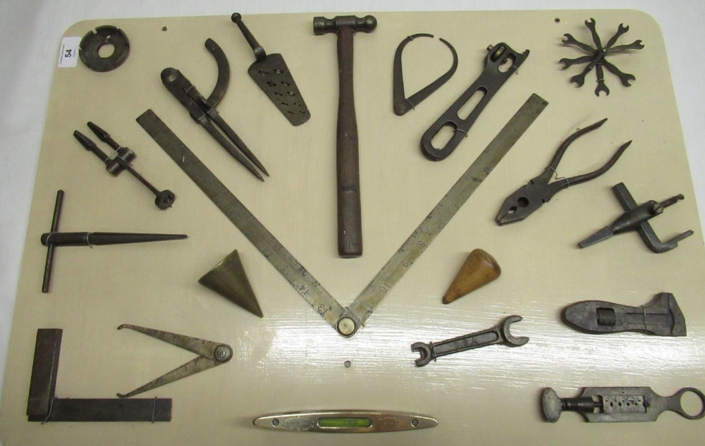 Mounted montage of vintage tools including square dividers, ball pen hammer, folding steel rule 45cm