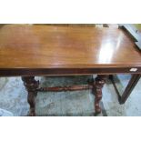 Mahogany hall table on two turned columns, each on two outsplayed supports with carved leaf