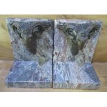 Pair of Theodore & Alexander Regency style marbleised book ends with cast metal lions heads