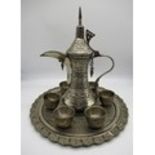 Middle Eastern silver plated coffee set comprising of a coffee pot, six cups and a serving tray