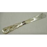 Early C20th Dunkerque de Souvenir mother of pearl letter knife with pierced carved handle flat blade