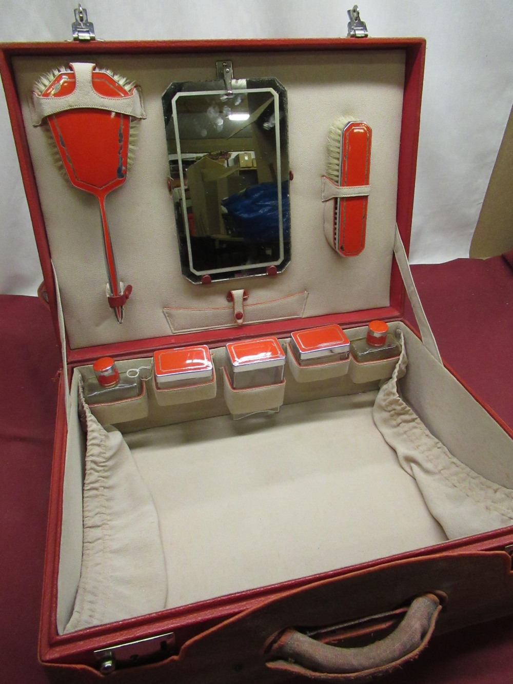 Art Deco period ladies travelling vanity case embossed red rexcine case with chrome plated fittings,