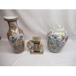 Oriental vase of birds between flowers, oriental elephant figure, Asian pot with images of