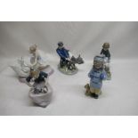 Lladro figure of a ballerina and swan, Royal Copenhagen figure of a man with cow, 3 Nao figures