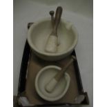 C20th chemist's mortar and pestle D15.5cm, larger mortar and pestle D28.5cm (A/F) and another wooden