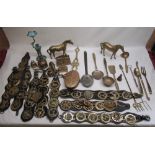 Collection of horse brasses, two brass horses, collection of brass forks, spoons etc