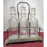 C20th EPNS three bottle swing handled tanatlus, beaded angular frame with column corners on an Art