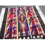 C20th North African wool rug, beige and chocolate brown ground with three stylized geometric striped
