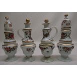 Pair of C19th Dutch opaque glass casters with hand painted floral decoration, pair of matching oil