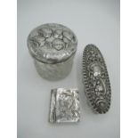 Edward VII hallmarked Sterling silver lidded dressing table jar with repoussé cherub head decoration