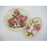 Moorcroft pottery oval dish, decorated with pink flowers and branch work on an ivory ground,