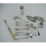 Two small silver lint brushes, silver sugar spoons, silver topped bottles, hat pins etc
