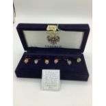 Fabergé guilloche enamel wine charms, edition I arrow head egg, in dark blue velvet case with