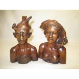 C20th, pair of hardwood Polynesian busts of female and male figure H30 and H34 respectively