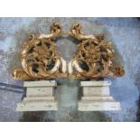 Pair of gilt wood revival crestings on integral stepped square plinths, H54cm W20cm, marble style