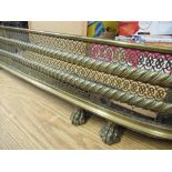 Victorian brass fire kerb, pierced and rope twist curved front with rolled edge on three paw feet