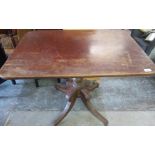 Mahogany dining table on turned central column on four outsplayed supports W69cm D95cm H76cm