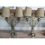 Pair of brass gothic revival two branch candelabras, of open twisted fleur de li's form, square