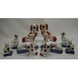 Collection of Staffordshire dogs, pair of Staffordshire cats