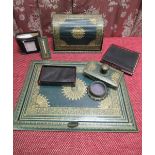 Early C20th gilt tooled green leather desk set comprising rectangular writing pad with reversible
