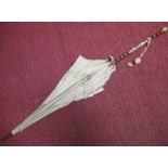 Victorian French parasol, the gold plated banded rosewood Sevres style porcelain inset handle