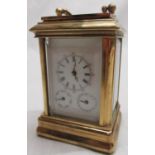 C20th miniature lacquered brass carriage clock with white enamel dial and subsidiary dials for day