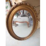 Early c20th oval bevel edged wall mirror in moulded gilt wood and gesso frame W55cm H84.5cm