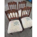 Set of four oak dining chairs with upholstered seats and turned supports