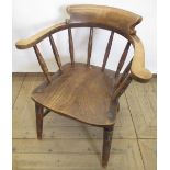 Early c20th smoker's bow chair of beech and elm construction, scroll back supported by turned