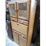 Stripped wood 1950/60's kitchen cabinet, with two upper bevelled edged glazed cupboard doors above