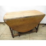 C20th medium oak drop leaf gateleg dining table with D shaped ends on barley twist columns W106cm (