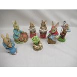 Seven Border Fine Arts and Enesco Beatrix Potter figurines including a Border Fine Arts money box (