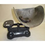 Large set of cast metal shop scales with scoop type bucket and selection of weights