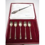 ER II cased set of British hallmarks silver tea spoons (one missing), and a button hook with